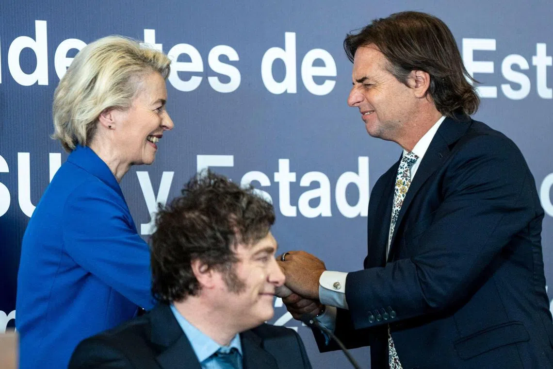 (From left) Ms Ursula von der Leyen, president of the European Commission, Mr Javier Milei, Argentina's president, and Mr Luis Lacalle Pou, Uruguay's president, during the Mercosur Leaders Summit where a long-delayed trade deal was agreed to. 