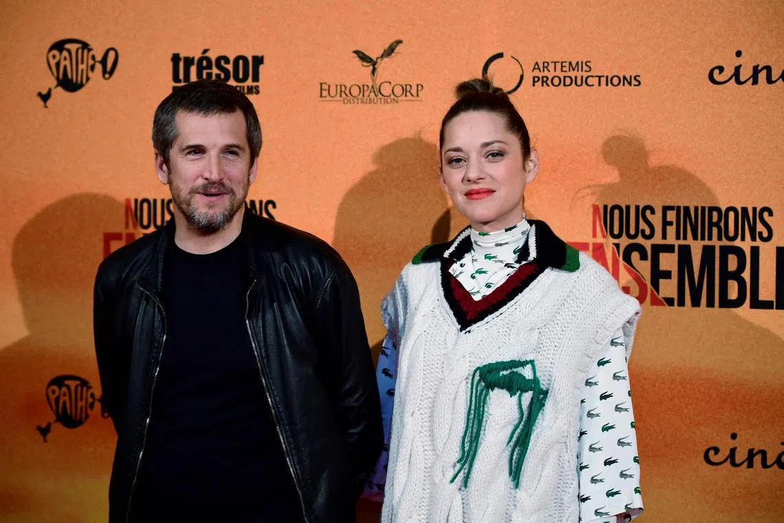 French film director Guillaume Canet (L) and French actress Marion Cotillard have announced that they are going separate ways. 