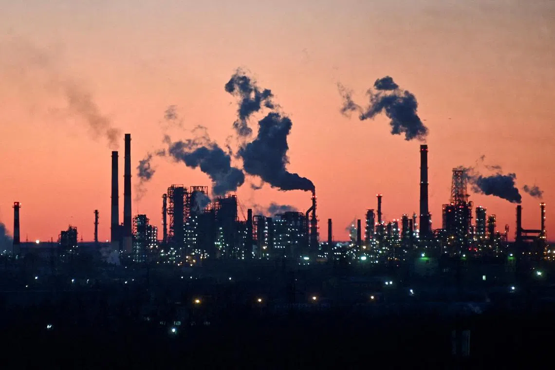 FILE PHOTO: A general view shows a local oil refinery during sunset in Omsk, Russia March 16, 2022. REUTERS/Alexey Malgavko/File Photo
