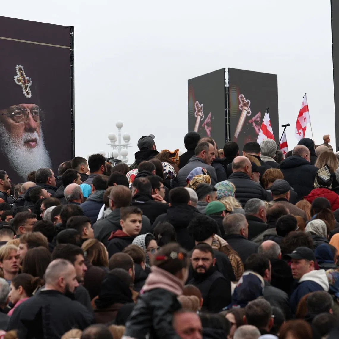 Mourners attend a funeral service of the late Georgia's Orthodox Patriarch Ilia II outside the Sameba Cathedral in Tbilisi, Georgia March 22, 2026. Giorgi Arjevanidze/Pool via REUTERS