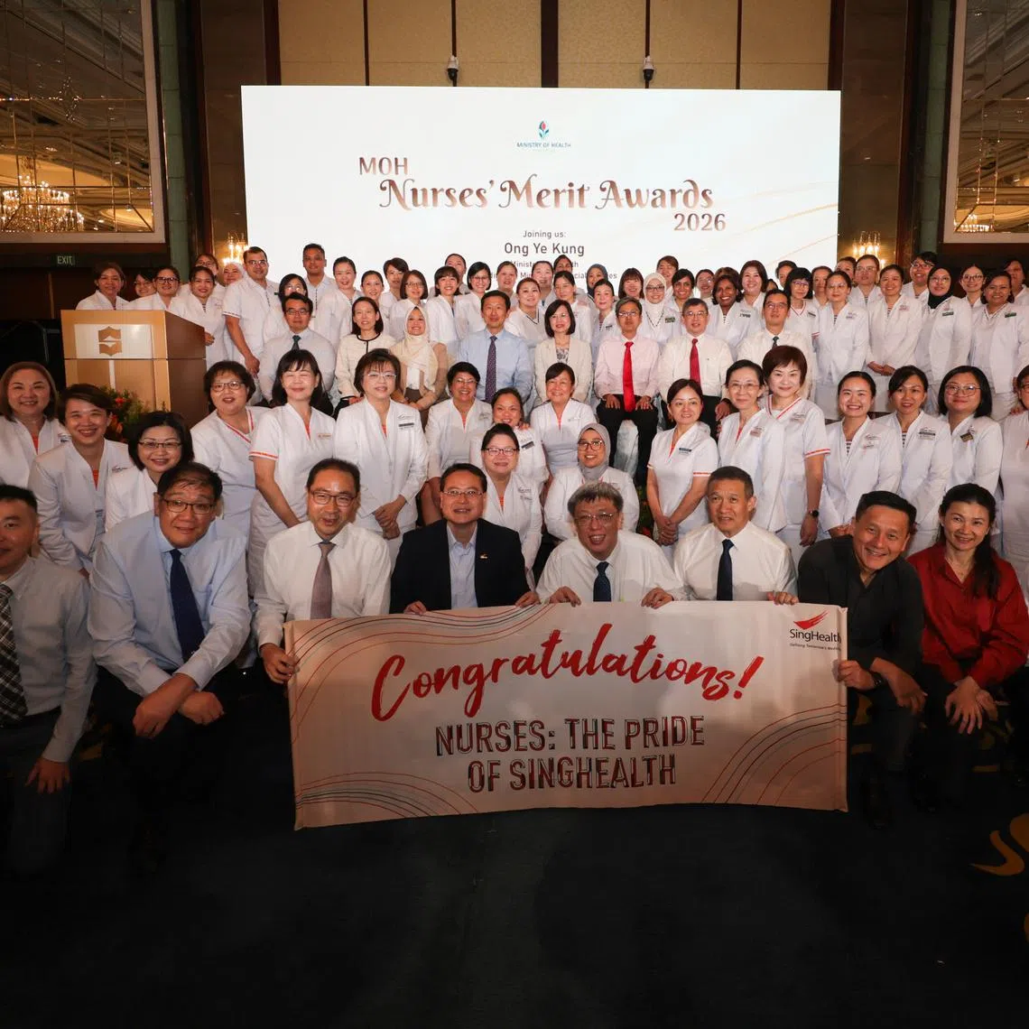 Health Minister Ong Ye Kung (middle row, fourth from left) at the Nurses’ Merit Award ceremony held at the Shangri-La Singapore on July 6.