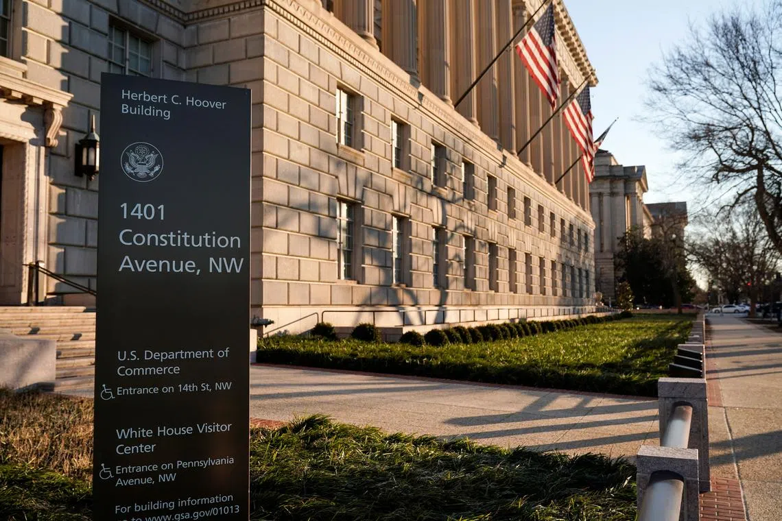 The Department of Commerce building is seen before an expected report of new home sales numbers in Washington, U.S., January 26, 2022.      REUTERS/Joshua Roberts/FILE PHOTO