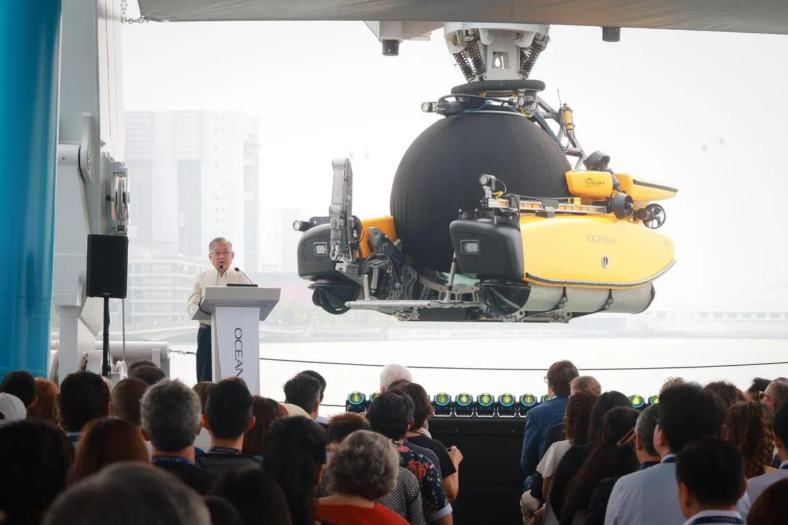 Deputy Prime Minister Gan Kim Yong speaking at the OceanX Summit aboard the OceanXplorer research vessel berthed at the Marina at Keppel Bay on Oct 7.