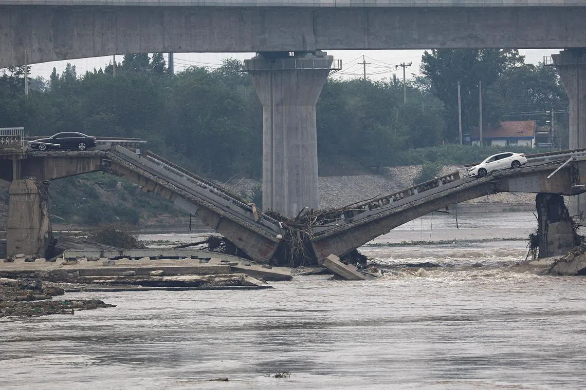 FILE PHOTO: A bridge is damaged after remnants of Typhoon Doksuri brought rains and floods in Beijing, China August 2, 2023. REUTERS/Tingshu Wang/File Photo