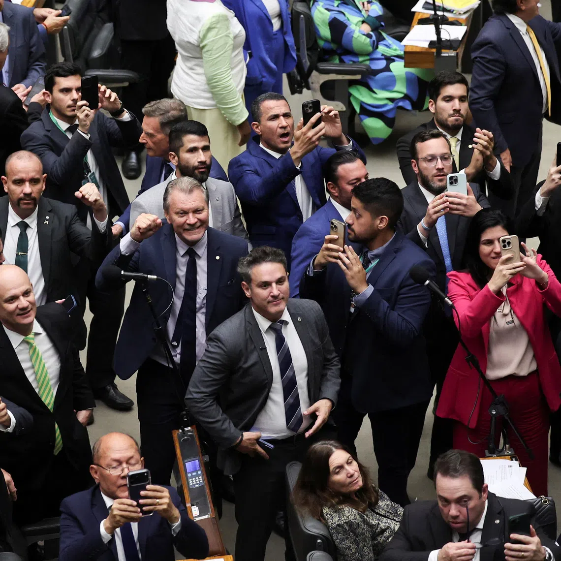 Lawmakers and supporters of former president Jair Bolsonaro celebrating a vote for a Bill, which could slash his prison sentence for plotting a coup, on Dec 10.