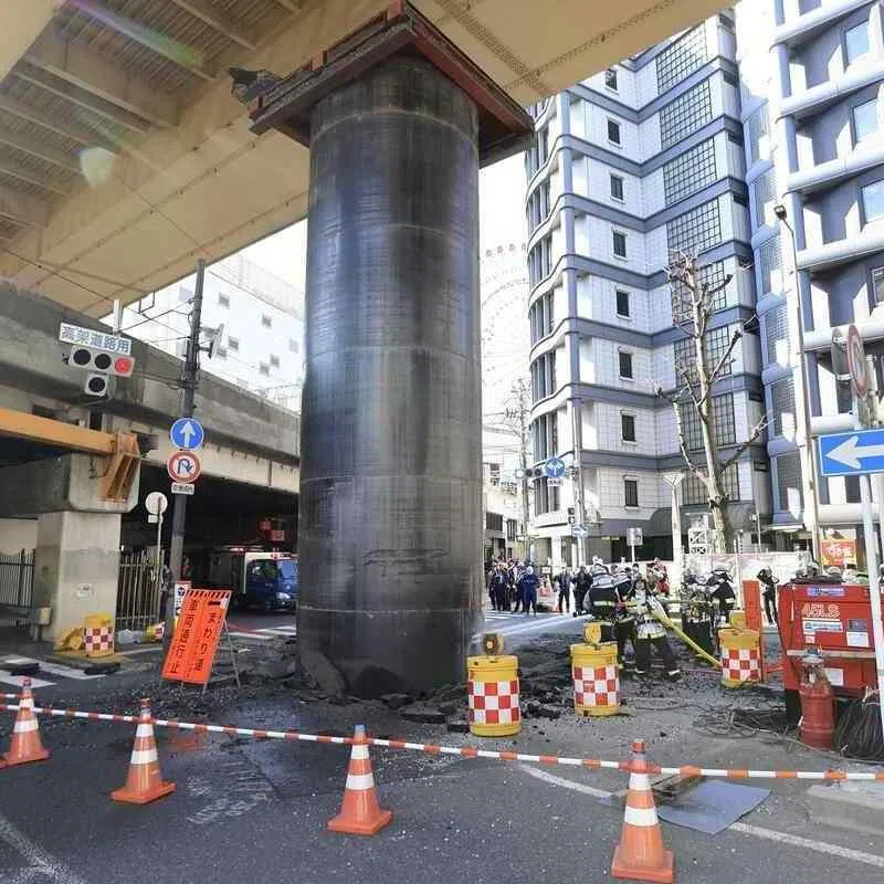 Fragments of asphalt was scattered around the pipe.