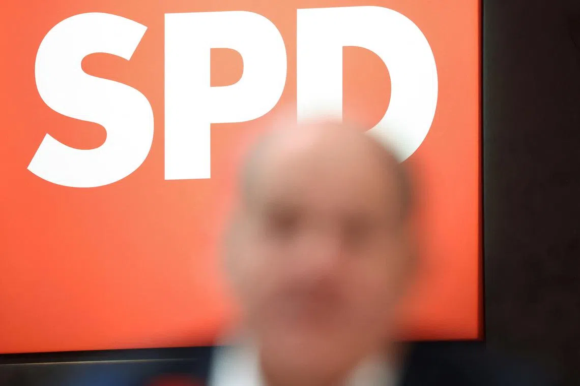 FILE PHOTO: German Chancellor Olaf Scholz is pictured in front of the logo of Germany’s Social Democratic SPD party during a three-day SPD convention in Berlin, Germany, December 8, 2023. REUTERS/Liesa Johannssen/File Photo