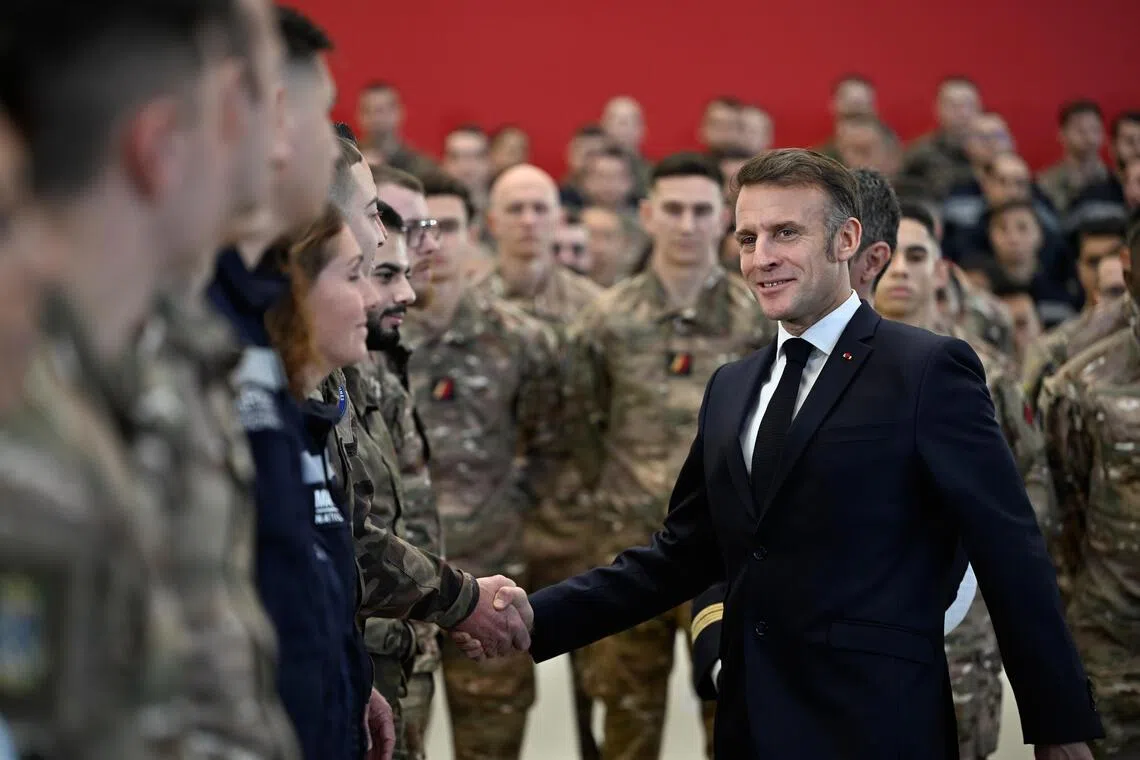 French President Emmanuel Macron visiting members of the armed forces at Istres Air Force Base in Istres, southern France, on Jan 15.
