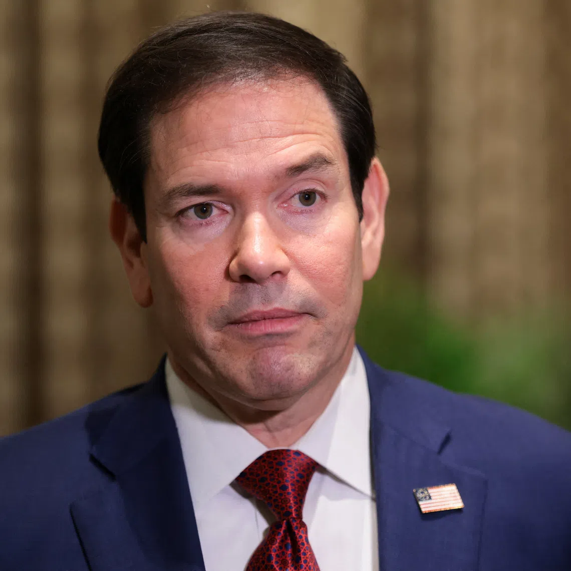 US Secretary of State Marco Rubio looks on as he speaks with members of the media at the Taj Mahal Palace hotel in Mumbai, India, October 21, 2026. REUTERS/Kylie Cooper/Pool