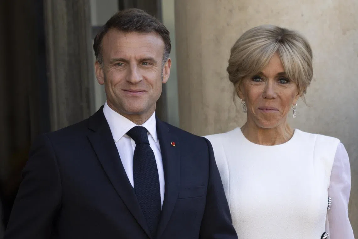 epa11398575 French First Lady Brigitte Macron and French President Emmanuel Macron wait for the arrival of US President Joe Biden his wife Jill Biden for an official state dinner given at the Elysee Palace, Paris, France, 08 June 2024. US President Joe Biden is being feted by French President Emmanuel Macron with a state visit, as the two allies aim to show off their partnership on global security issues and move past trade tensions.  EPA-EFE/ANDRE PAIN