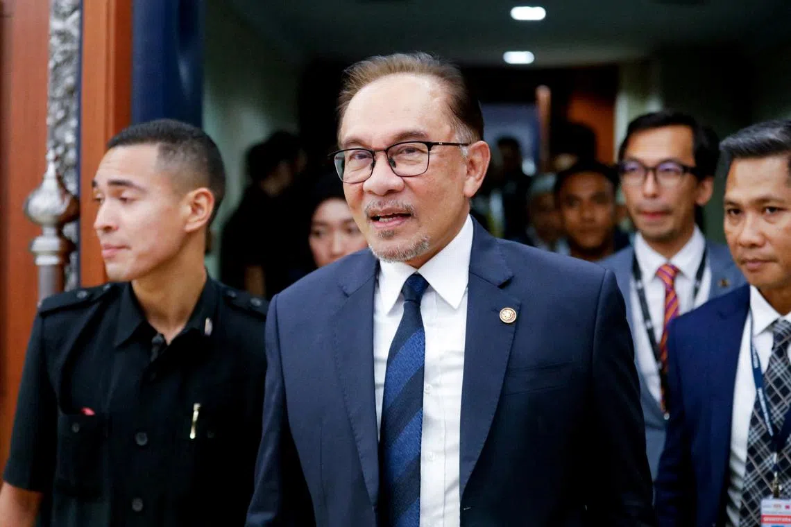Malaysian Prime Minister Anwar Ibrahim leaves the Lower House of Parliament after receiving a vote of confidence in Kuala Lumpur, Malaysia, on Dec 19, 2022. 