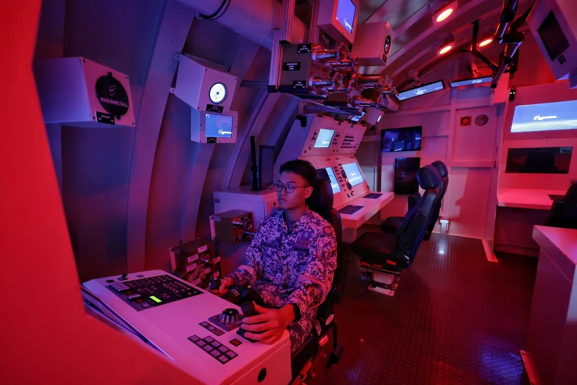 (EMBARGOED TILL 12PM SEPT 25, 2024)
ME1 Axell Lim, 24, underwater operator for RSS Invincible, running a demonstration of a deep dive during an emergency procedure in the dive trainer during a media tour of the new Invincible-class Submarine Training Centre at Changi Naval Base on Sept 16, 2024. ST PHOTO: KEVIN LIM mysub25