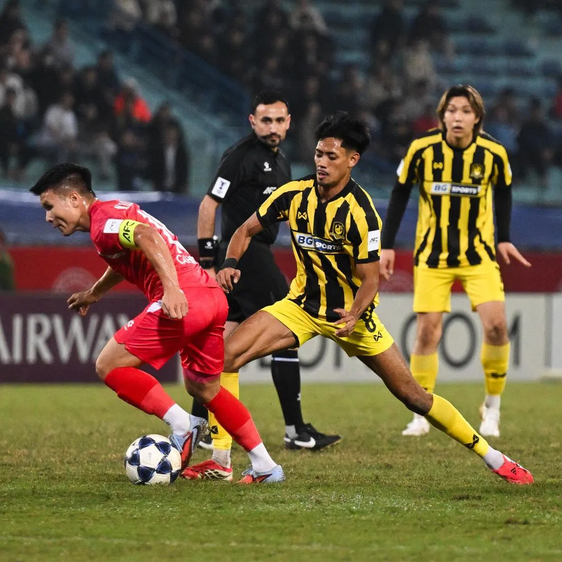 A brace from Cong An Ha Noi captain Nguyen Quang Hai (left) sinks BG Tampines Rovers in the first leg of their AFC Champions League Two round of 16 tie.