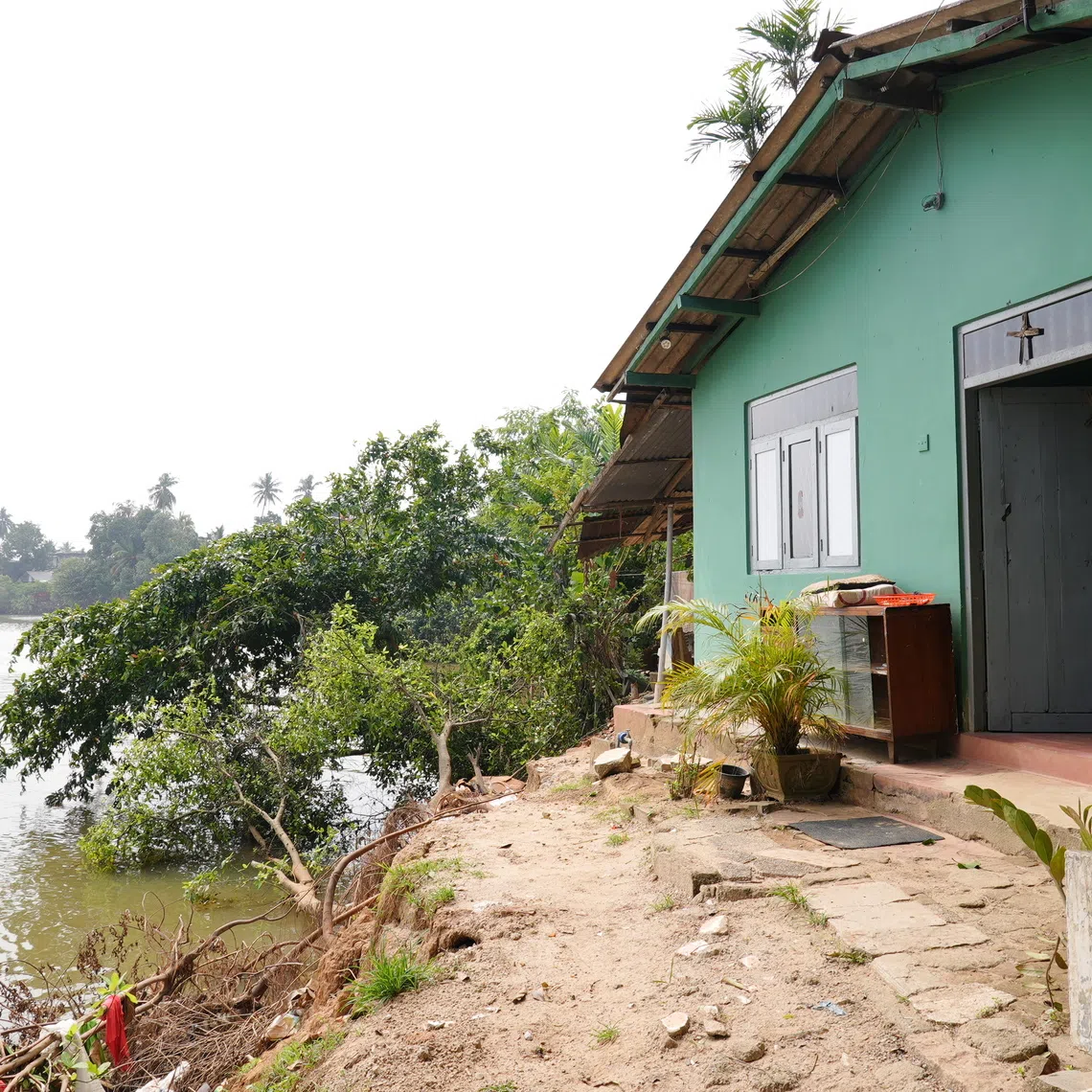 The Kelani River in Sri Lanka now runs just a few feet from Madam M Davika's doorstep.