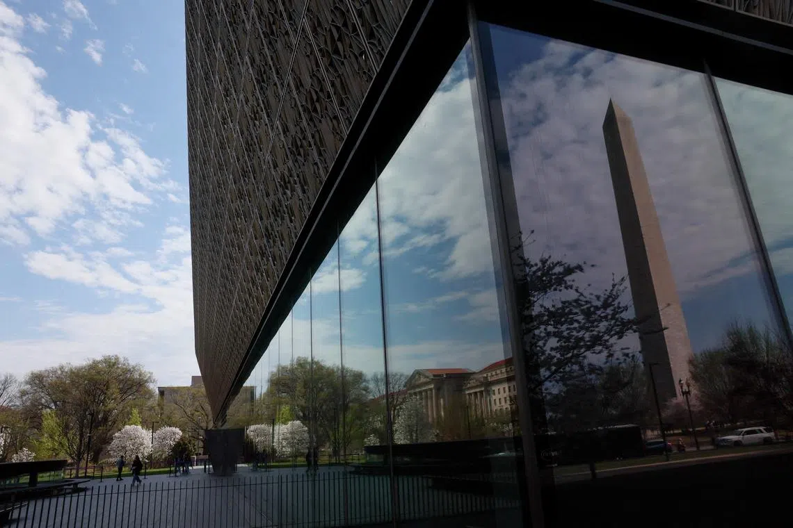 FILE PHOTO: People enter and exit the Smithsonian’s National Museum of African American History and Culture in Washington, D.C., U.S., March 28, 2025. REUTERS/Leah Millis/File Photo