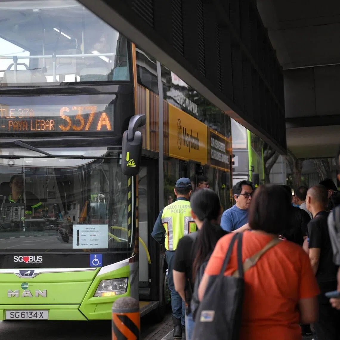 Commuters board a shuttle bus from Serangoon MRT Station to Paya Lebar MRT on Jan 19.