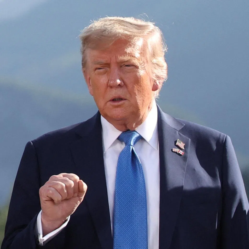 U.S. President Donald Trump gestures as he attends a family photo session during the G7 Summit, in Kananaskis, Alberta, Canada, June 16, 2025. REUTERS/Suzanne Plunkett/Pool