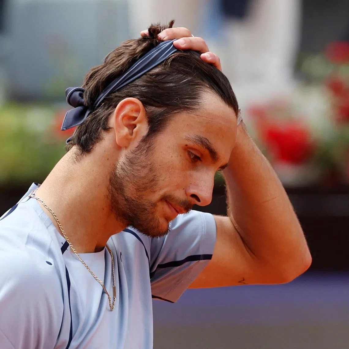 Tennis - Italian Open - Foro Italico, Rome, Italy - May 12, 2026 Italy's Lorenzo Musetti looks dejected after losing his round of 16 match against Norway's Casper Ruud REUTERS/Ciro De Luca