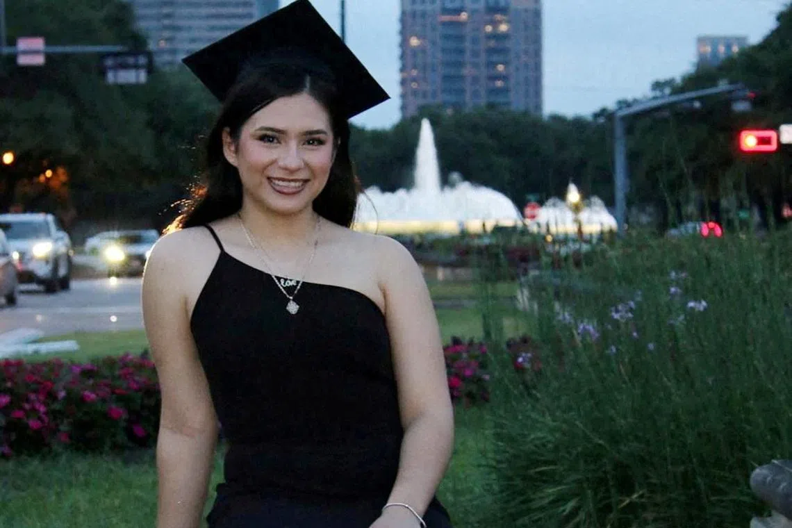 Babson College student Any Lucia Lopez Belloza poses wearing a mortarboard after graduating from high school in Boston, Massachusetts, U.S., in 2025. massdeportationdefense.org/Handout via REUTERS