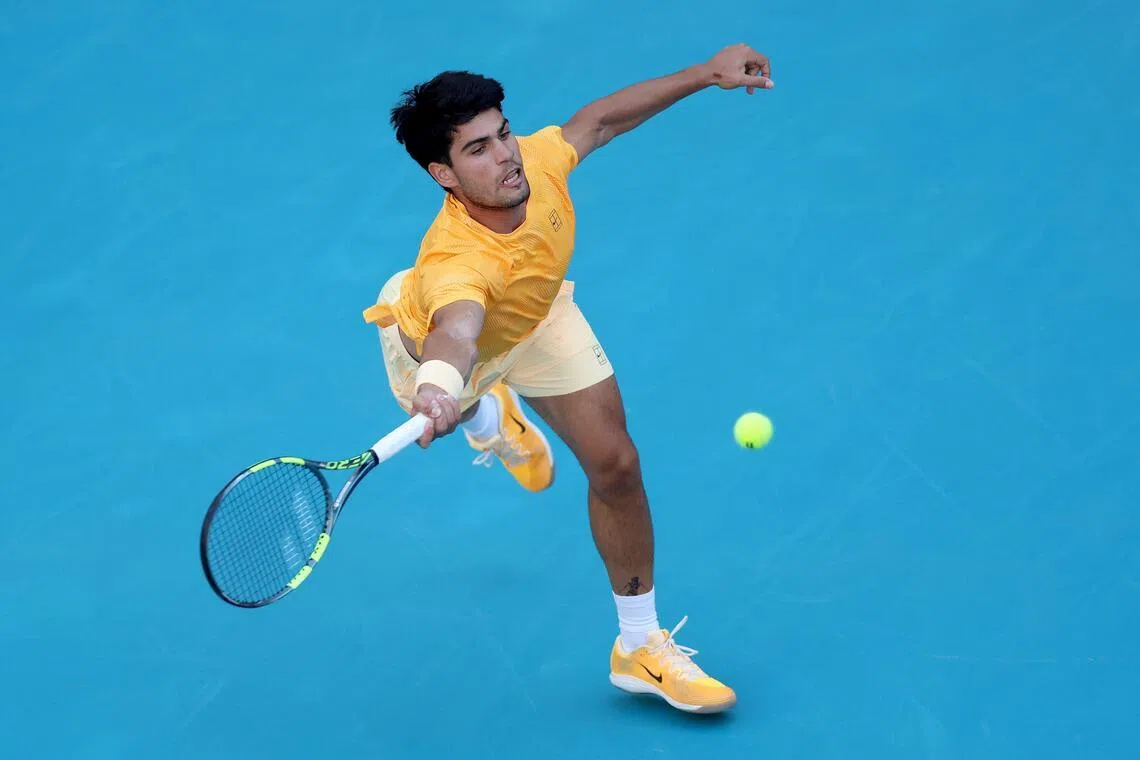 MIAMI GARDENS, FLORIDA - MARCH 22: Carlos Alcaraz of Spain lunges for a ball while playing Sebastian Korda of the United States on Day 6 of the Miami Open Presented by Itau at Hard Rock Stadium on March 22, 2026 in Miami Gardens, Florida.   Matthew Stockman/Getty Images/AFP (Photo by MATTHEW STOCKMAN / GETTY IMAGES NORTH AMERICA / Getty Images via AFP)