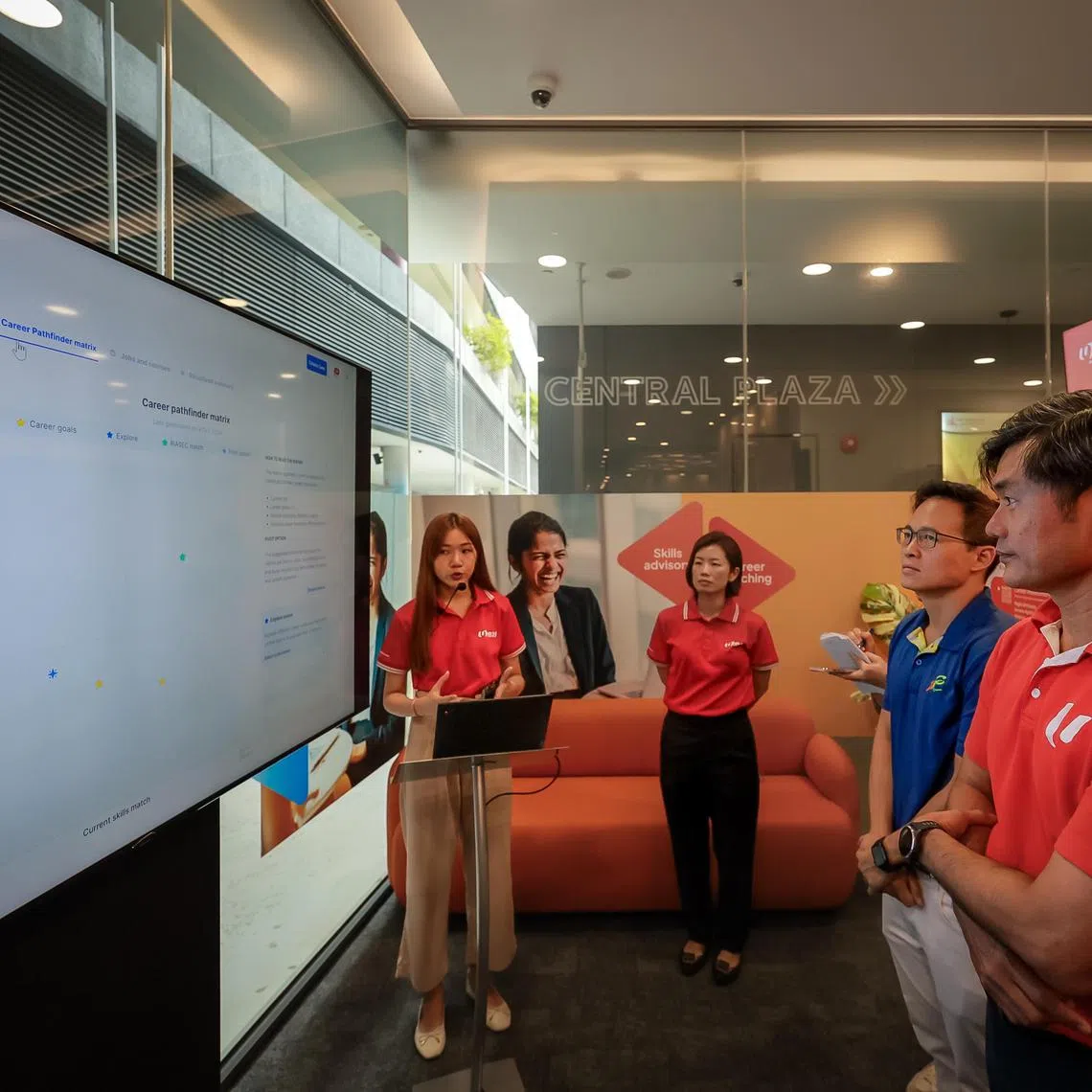 From right: 
Mr Desmond Tan, Deputy Secretary-General, National Trades Union Congress (NTUC), and Senior Minister of State, Prime Minister's Office, Deputy Secretary-General, National Trades Union Congress (NTUC); 

and Mr Desmond Choo, Mayor of North East District, and Assistant Secretary-General, NTUC; 

being given a demonstration of the AI-powered Virtual Career Coach (VCC) at the e2i Career Centre at ServiceSG Centre at Our Tampines Hub on Oct 4, 2024.