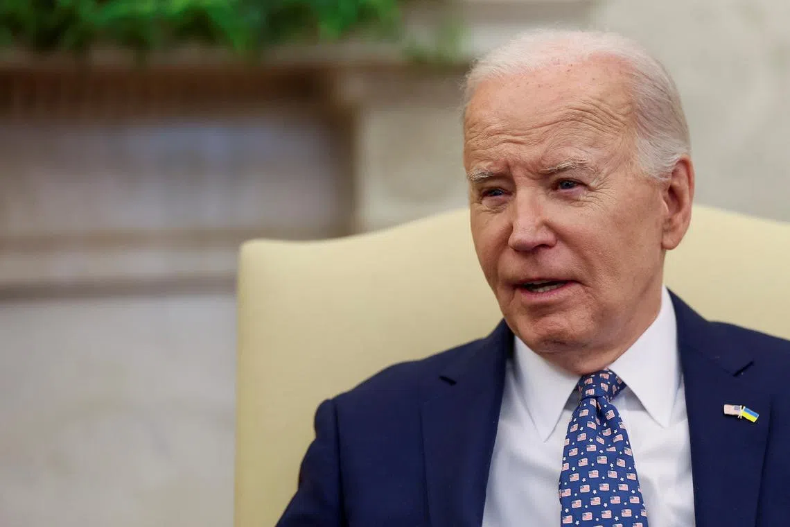 U.S. President Joe Biden looks on as him and Vice President Kamala Harris (not pictured) meet with congressional leaders in the Oval Office at the White House in Washington, U.S., February 27, 2024. REUTERS/Leah Millis