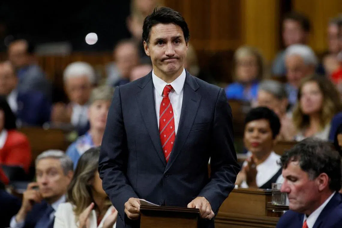 FILE PHOTO: Canada's Prime Minister Justin Trudeau rises to make a statement in the House of Commons on Parliament Hill in Ottawa, Ontario, Canada, Sept. 18, 2023. REUTERS/Blair Gable/File Photo
