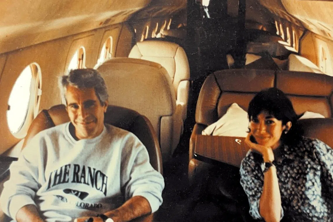 FILE PHOTO: Jeffrey Epstein and Ghislaine Maxwell are seen in this image released by the Department of Justice in Washington, D.C., U.S., on December 19, 2025 as part of a new trove of documents from its investigations into the late financier and convicted sex offender Jeffrey Epstein. U.S. Justice Department/Handout via REUTERS/File Photo