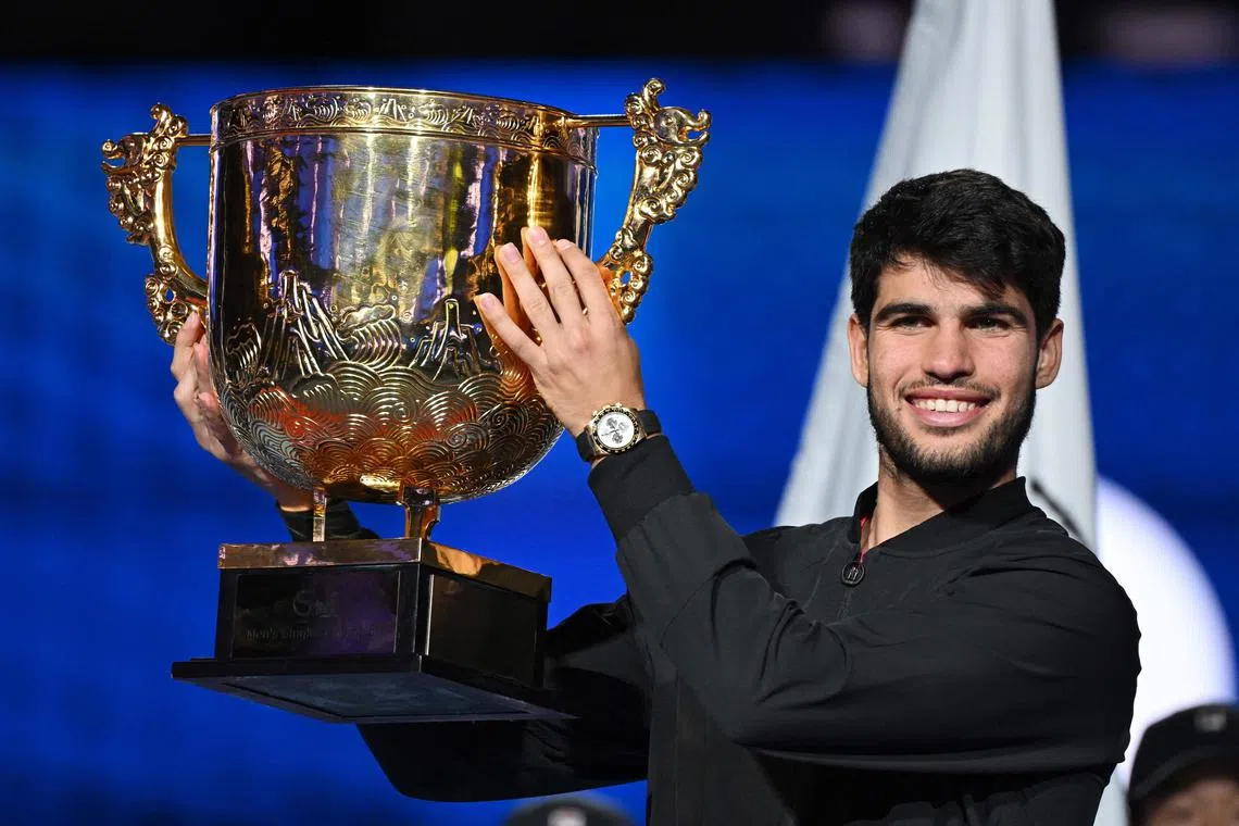 Spain’s Carlos Alcaraz celebrates with the trophy after winning the China Open in Beijing.