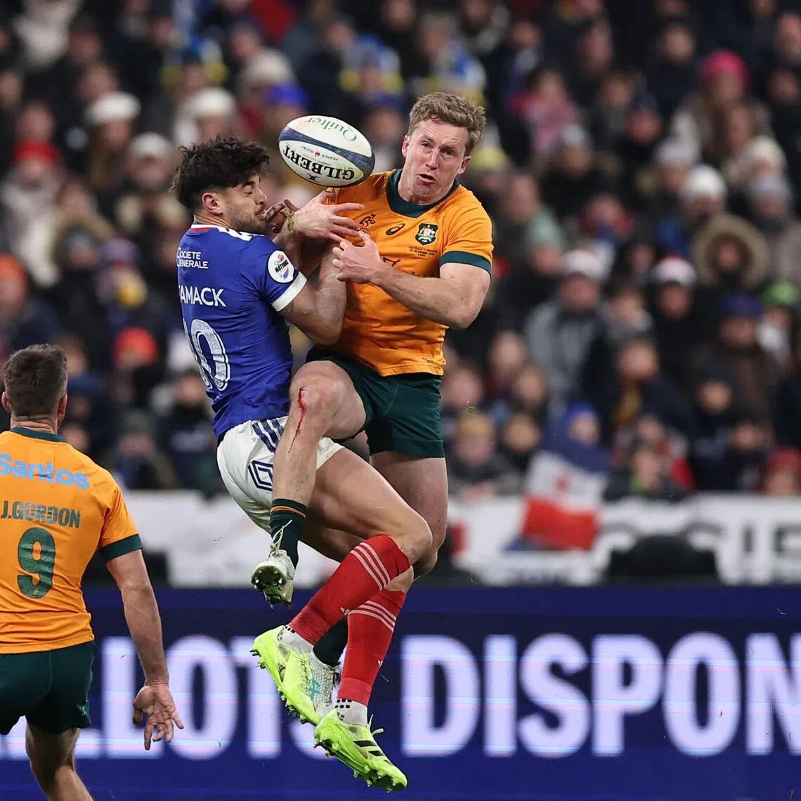 France fly-half Romain Ntamack  and Australia wing Harry Potter contesting a high ball during Les Bleus' 48-33 win in the Autumn Nations Series international rugby union Test at the Stade de France  on Nov 22, 2025.