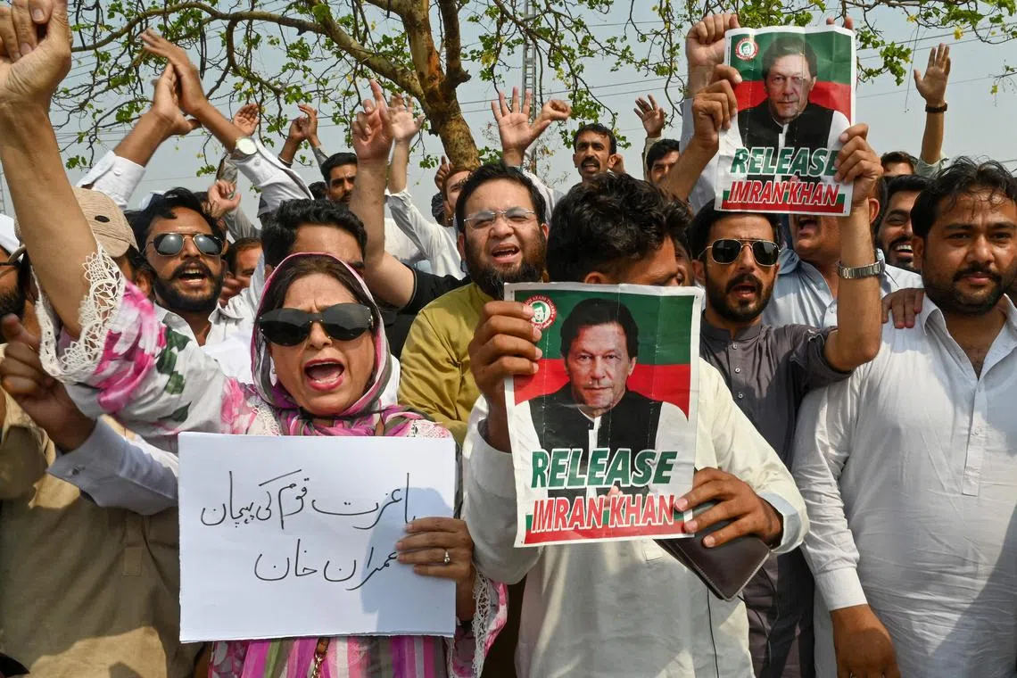 Pakistan's former prime minister Imran Khan's supporters protest outside the court in Islamabad on June 27, 2024, to demand the release of Khan and his wife Bushra Bibi. 