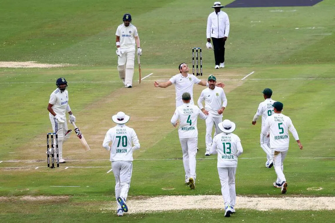 Cricket - First Test - South Africa v India - SuperSport Park Cricket Stadium, Centurion, South Africa - December 27, 2023 South Africa's Gerald Coetzee celebrates the wicket of India's Mohammed Siraj with teammates REUTERS/Esa Alexander/file photo