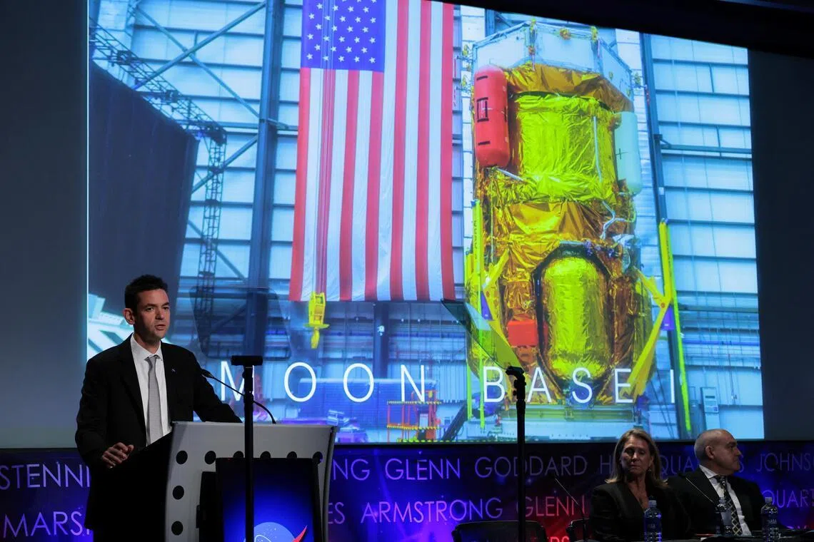 NASA Administrator Jared Isaacman, with acting Associate Administrator Lori Glaze and Moon Base Program Executive Carlos Garcia-Galan, holds a news conference on updated plans for the agency’s Moon Base initiative for a long-term lunar presence, at NASA headquarters in Washington, D.C., U.S., May 26, 2026. REUTERS/Jonathan Ernst