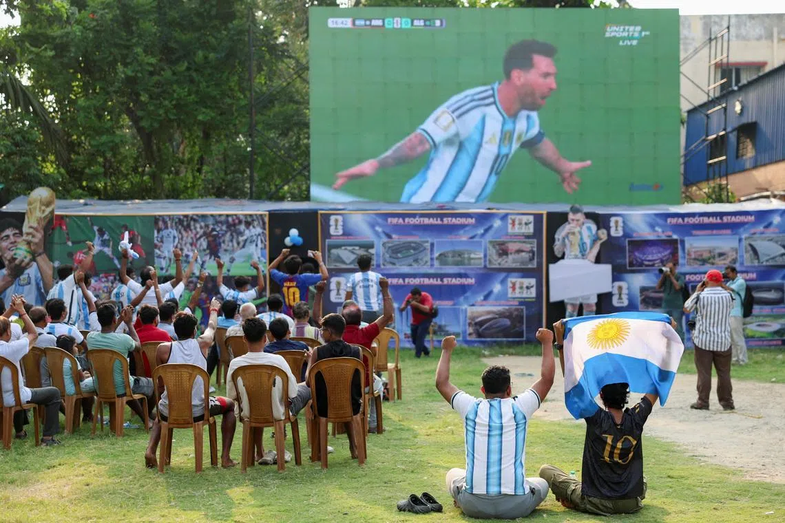 Fans watch the Group J match between Argentina and Algeria of the 2026 FIFA World Cup on a screen early morning in Kolkata, India, June 17, 2026. REUTERS/Sahiba Chawdhary