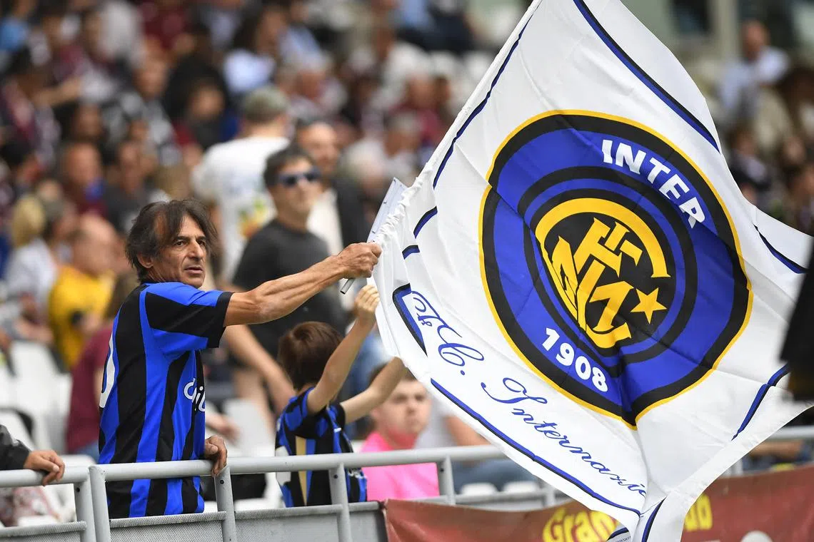 FILE PHOTO; Soccer Football - Serie A - Torino v Inter Milan - Stadio Olimpico Grande Torino, Turin, Italy - May 11, 2025 Inter Milan fan waves a flag in the stands before the match REUTERS/Massimo Pinca/ FIle Photo