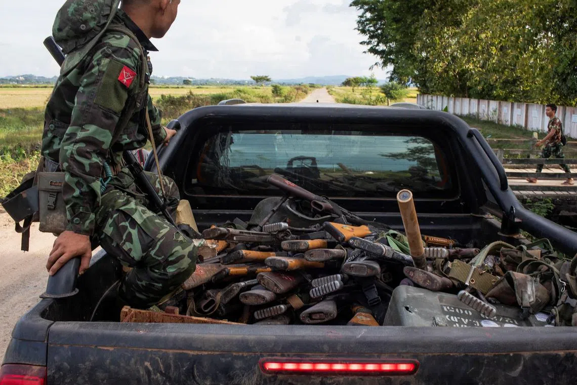 A member of the Karenni Army rides a truck with sized weapons during a battle in Loikaw in Kayah State, Myanmar November 12, 2023. REUTERS/Stringer