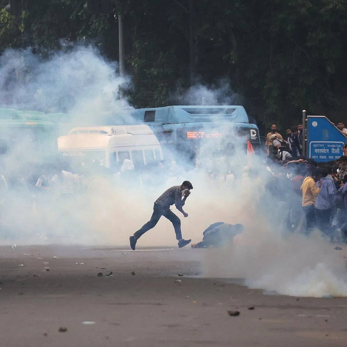 Tear gas spreads around protesters during a demonstration on July 20.