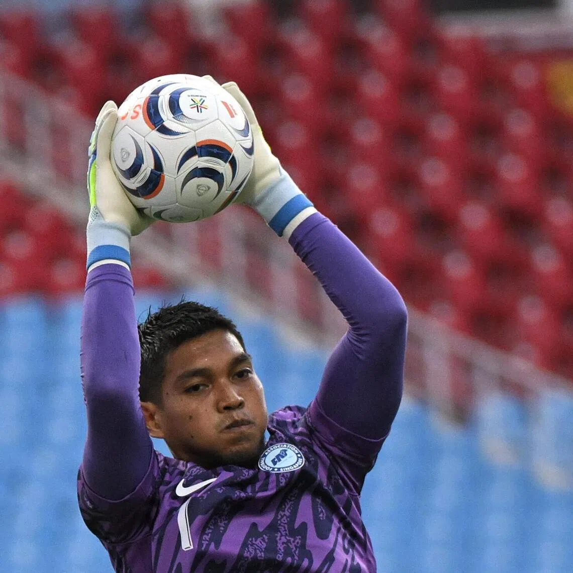 Singapore goalkeeper Izwan Mahbud going through the paces during a training session at the My Dinh National Stadium in Hanoi on July 30.