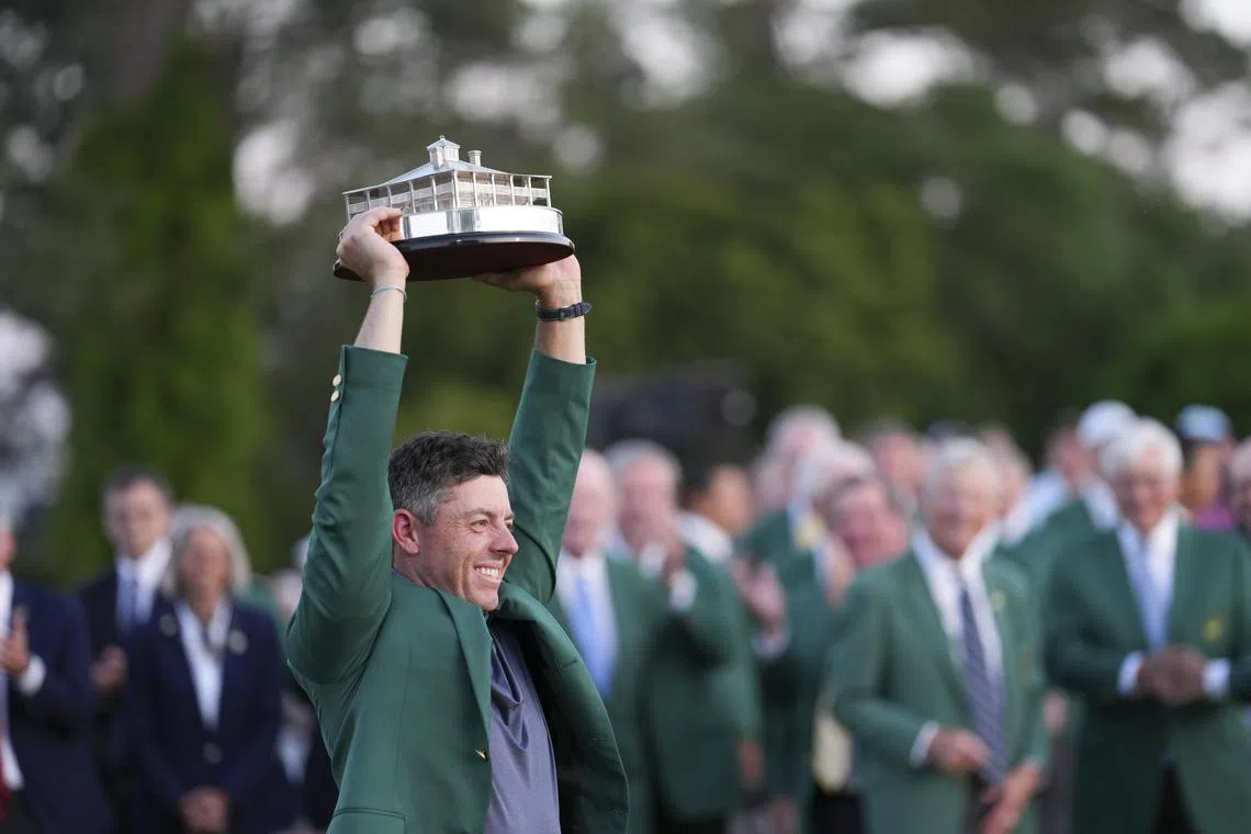 Northern Ireland's Rory McIlroy lifting the trophy after winning the Masters Tournament on April 13.