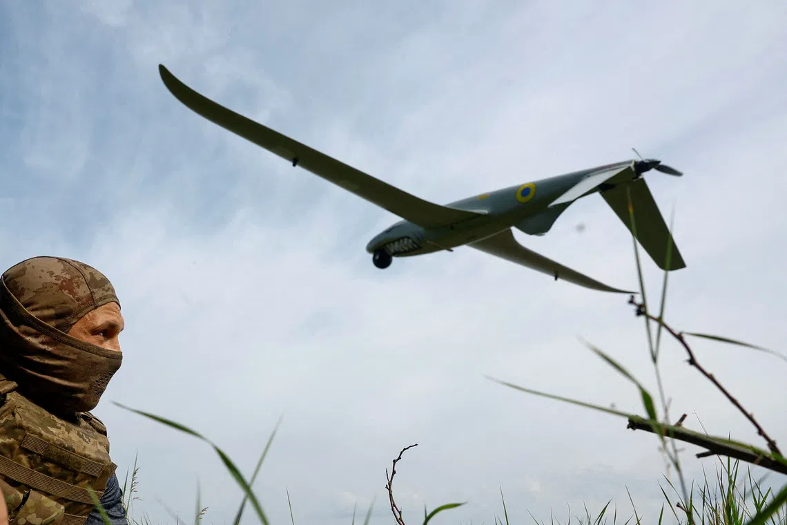 FILE PHOTO: A service member of the 422nd Unmanned Systems Regiment 'Luftwaffe' of the Ukrainian Armed Forces, looks at a Shark reconnaissance drone as it launches from a position near a front line, amid Russia's attack on Ukraine, in an undisclosed location in Southern Ukraine, on an undisclosed date, 2026. REUTERS/Valentyn Ogirenko/File Photo