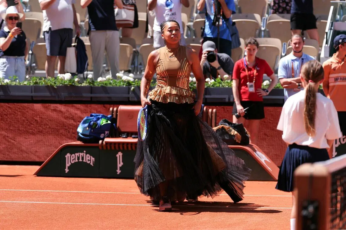 Japan's Naomi Osaka arriving on Court Suzanne-Lenglen ahead over her 6-3, 7-6 (7-3) win against Germany's Laura Siegemund on Day 3 of the French Open tennis tournament at Roland Garros in Paris on May 26, 2026. 