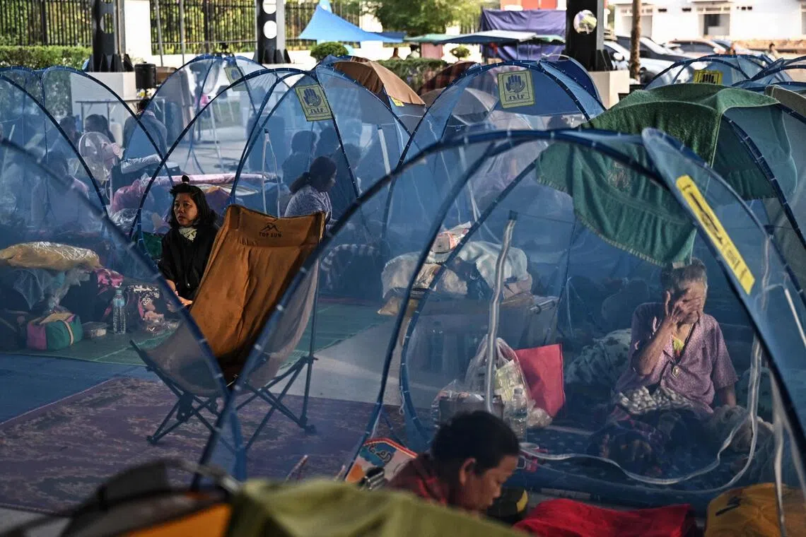 People displaced by renewed clashes between Thailand and Cambodia take shelter at an evacuation centre in Thailand’s Sa Kaeo province.
