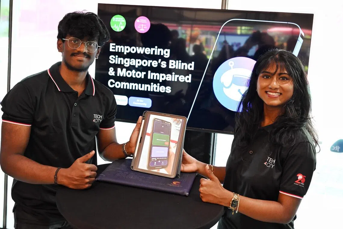 Members of the winning team, Sunday, from left, Senthilkumar Kunalkumar and Kumar Devadharshini, at the fifth Huawei Tech4City Competition finals, held at Launchpad@One-North on Oct 27.