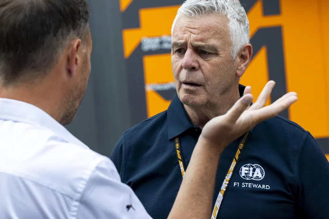 FIA steward Derek Warwick in conversation on Canadian Grand Prix media day in the paddock on June 12 at the Circuit Gilles-Villeneuve in Montreal.