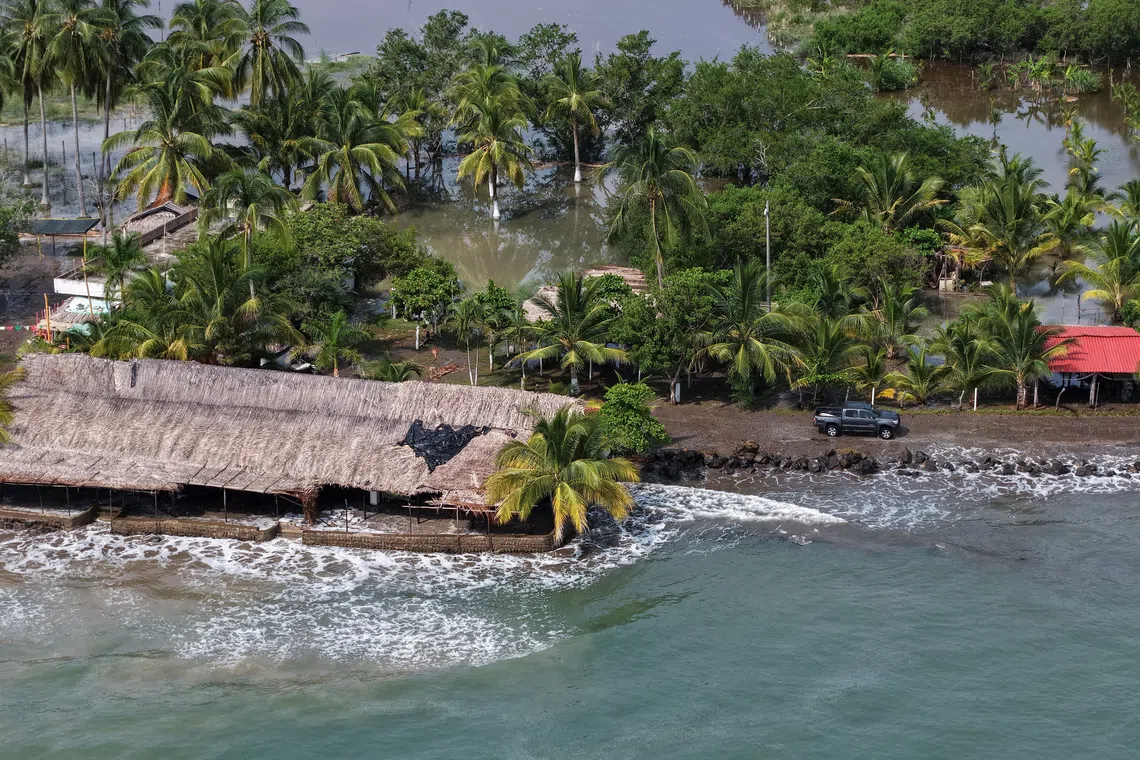 A drone view shows a flooded area affected by elevated tides caused by Hurricane Polo in San Blas, Nayarit, Mexico, September 26, 2026. REUTERS/Christian Ruano