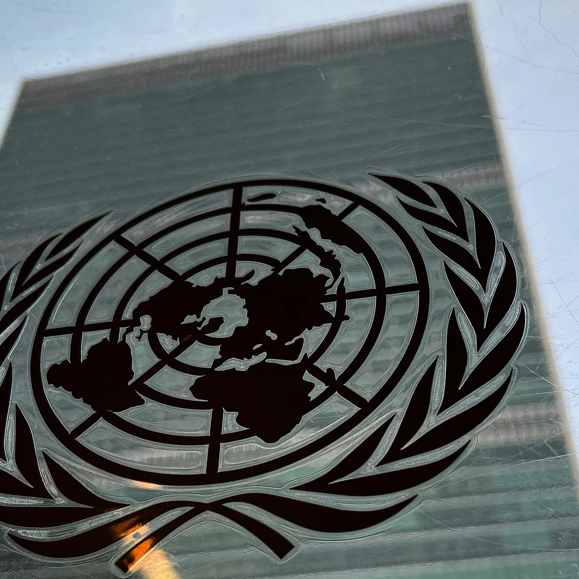 FILE PHOTO: The United Nations headquarters building is pictured with a UN logo in the Manhattan borough of New York City, New York, U.S., March 1, 2022.  REUTERS/Carlo Allegri/ File Photo