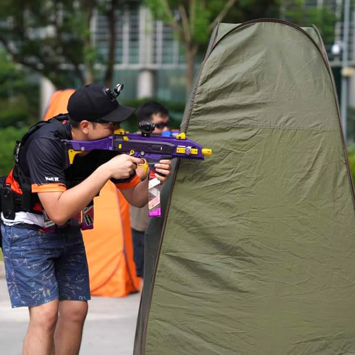 Mr Matthew Wong, a regular NerfSG participant and Nerf hobbyist, takes aim with his 3D printed nerf blaster. 