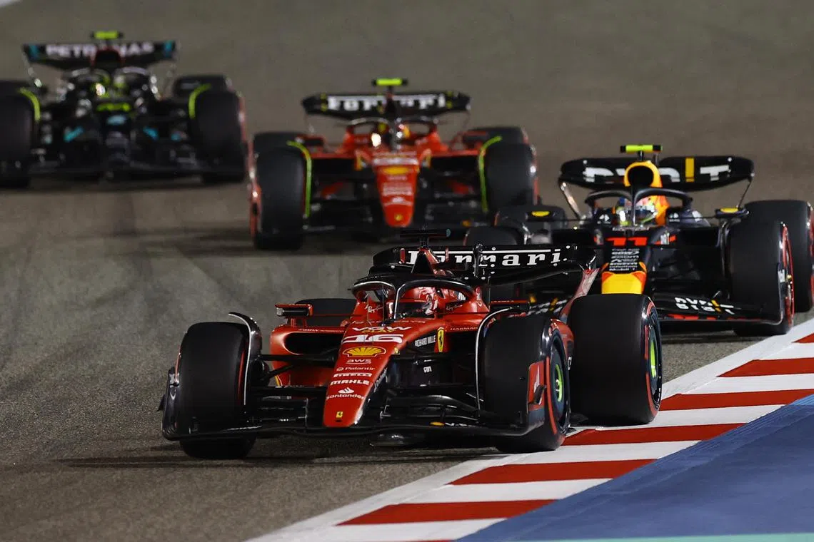 Formula One F1 - Bahrain Grand Prix - Bahrain International Circuit, Sakhir, Bahrain - March 5, 2023 Ferrari's Charles Leclerc and Red Bull's Sergio Perez in action during the race REUTERS/Rula Rouhana/ File photo