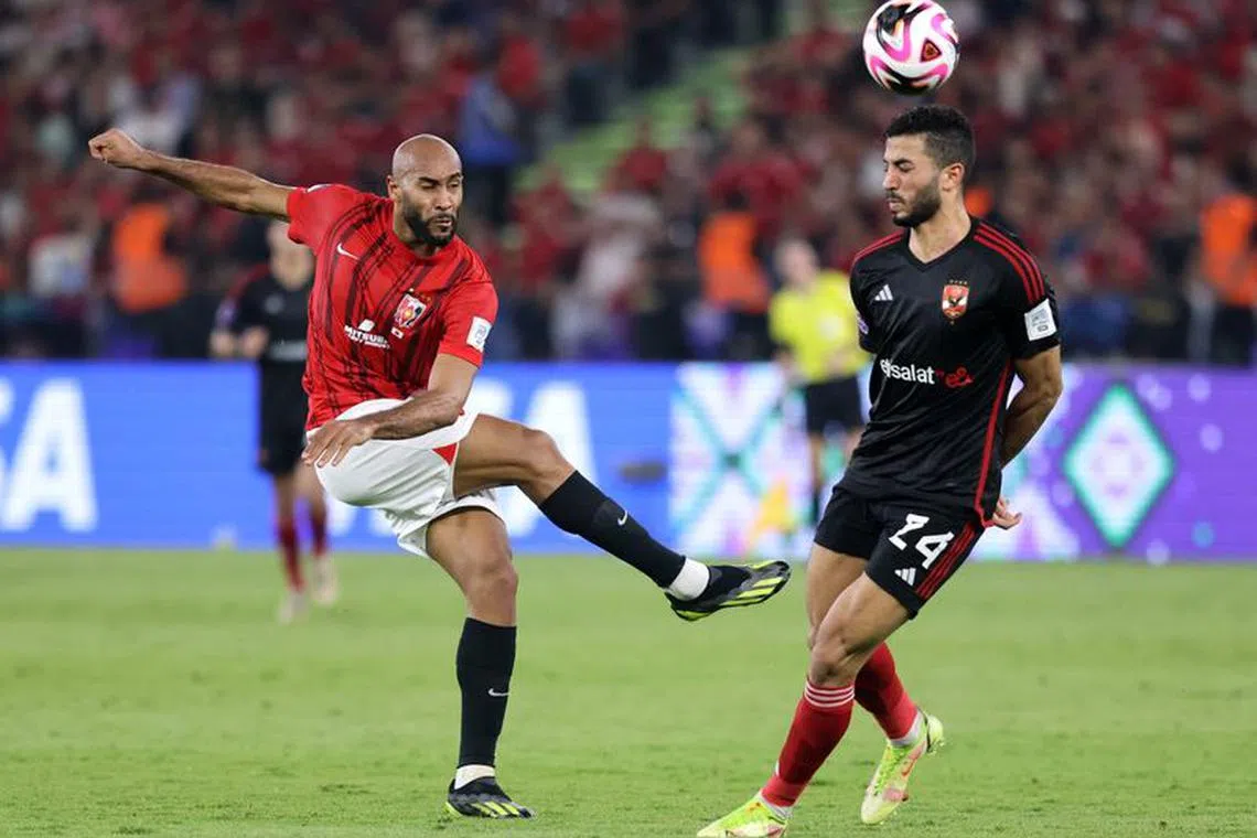 Soccer Football - Club World Cup - Third Place Playoff - Urawa Red Diamonds v Al-Ahly - Prince Abdullah Al Faisal Stadium, Jeddah, Saudi Arabia - December 22, 2023 Urawa Red Diamonds' Jose Kante in action with Al Ahly's Mohamed Abdelmonem REUTERS/Ahmed Yosri