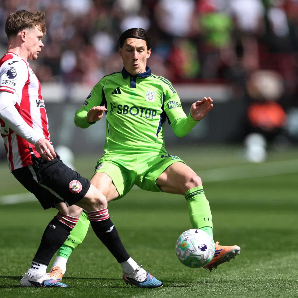 Soccer Football - Premier League - Brentford v Fulham - GTech Community Stadium, London, Britain - April 18, 2026 Fulham's Harry Wilson in action with Brentford's Keane Lewis-Potter REUTERS/Toby Melville